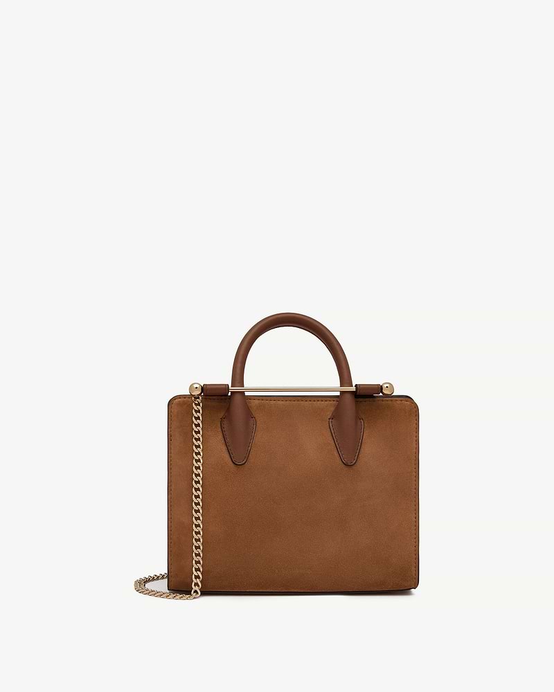 Tan suede mini tote with top handles and gold chain strap.