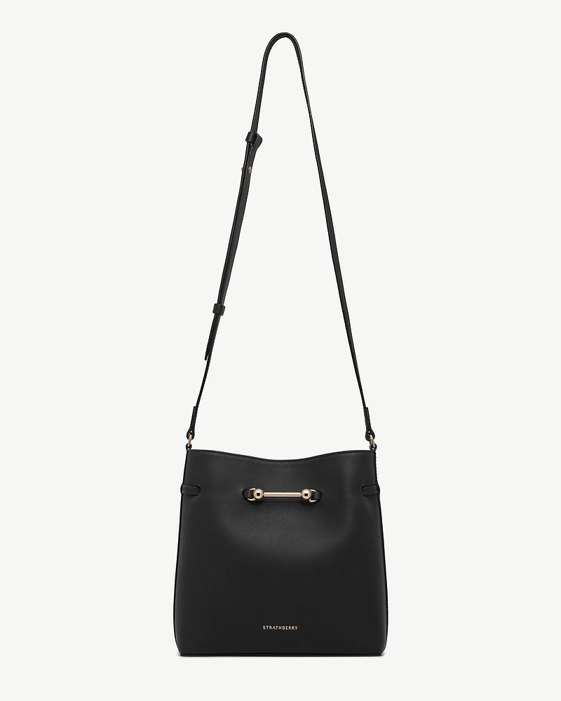 Black Corda bucket bag with adjustable shoulder strap and gold hardware, Strathberry.