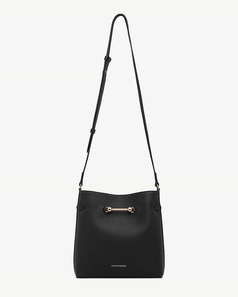Black Corda bucket bag with adjustable shoulder strap and gold hardware, Strathberry.