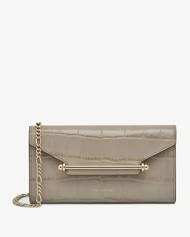 Strathberry Multrees chain wallet in croc-embossed beige leather with gold hardware.