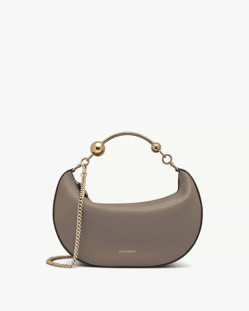 Taupe crescent moon bag with gold chain and Strathberry logo