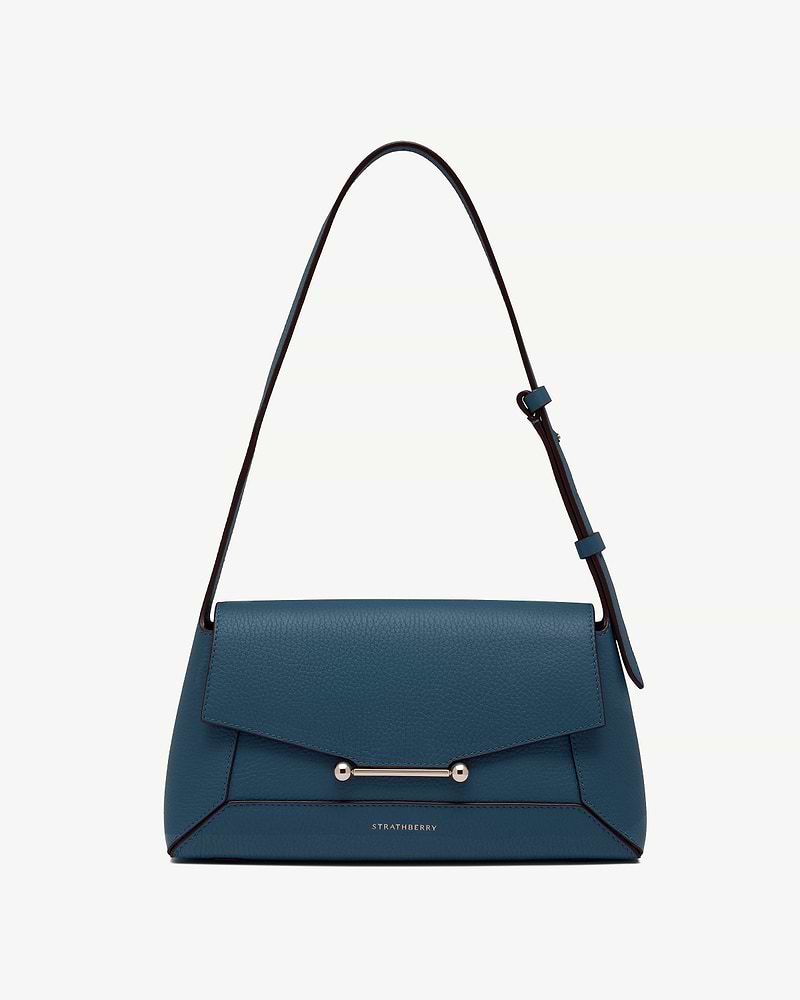 Strathberry mosaic shoulder bag in loch blue with gold bar hardware.