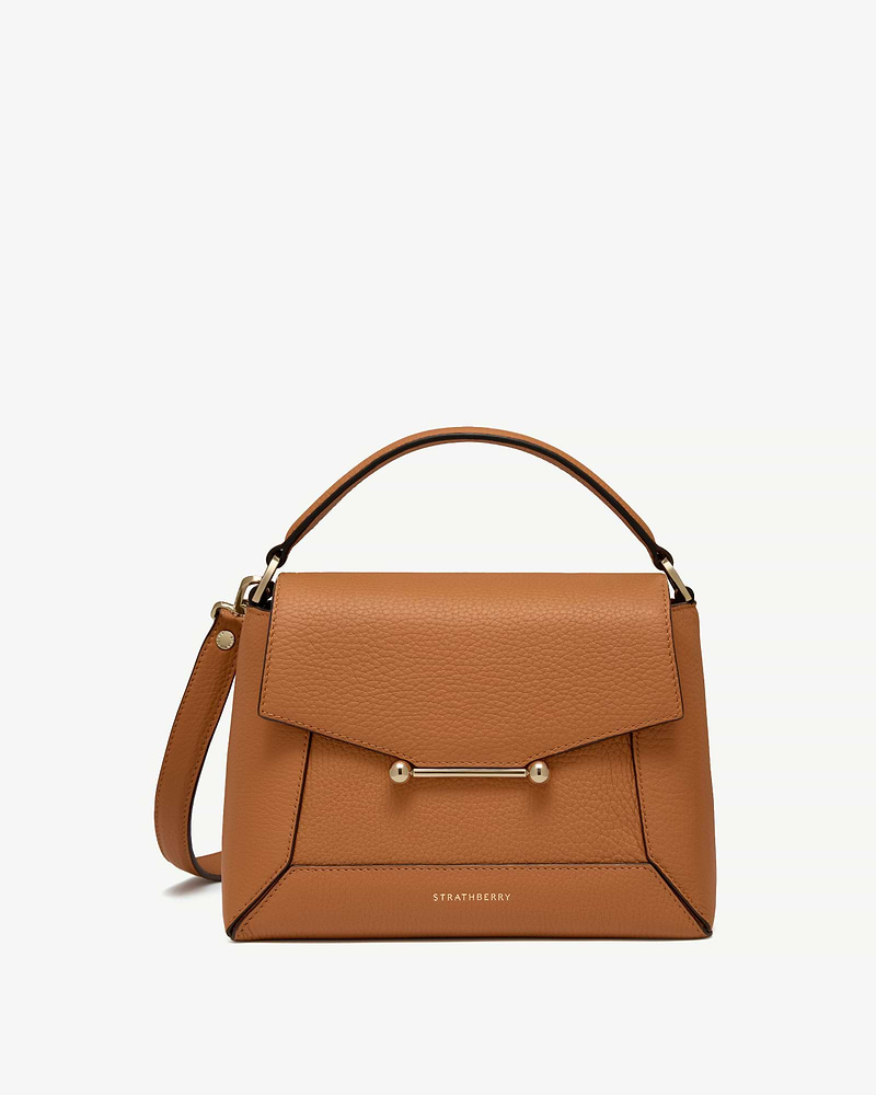 Honey leather mosaic bag with top handle, gold bar detail and Strathberry logo.