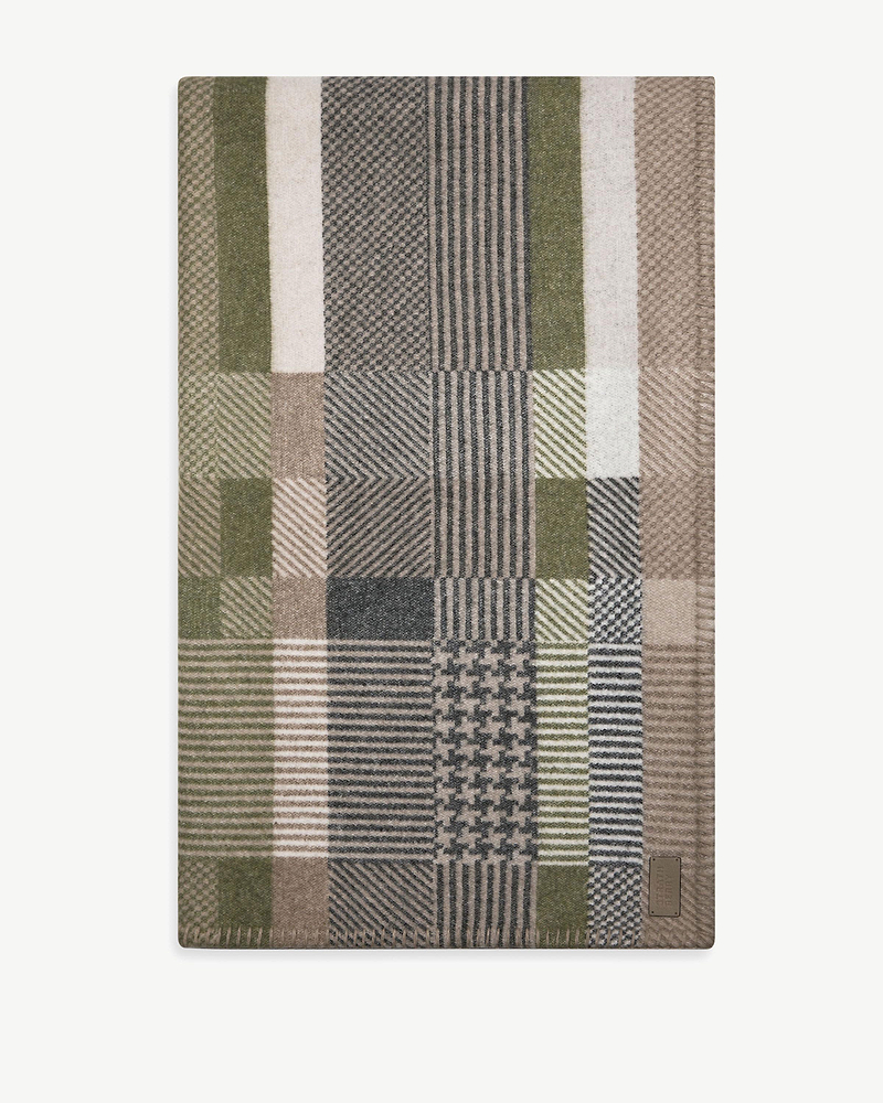 Strathberry tartan wool-cashmere blanket with green, beige and grey checked panels and logo patch.
