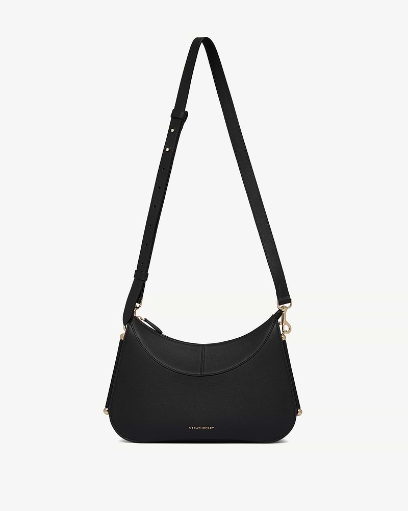 Black Strathberry Nest shoulder bag with adjustable strap and gold hardware.