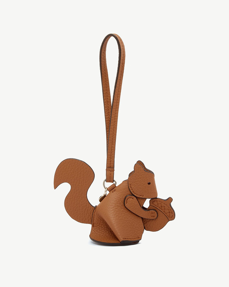 Tan squirrel shaped leather bag charm with leather strap and gold tone ring