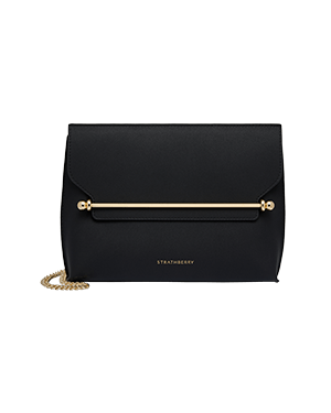 Black Stylist shoulder bag with gold bar detail, chain strap, Strathberry logo.