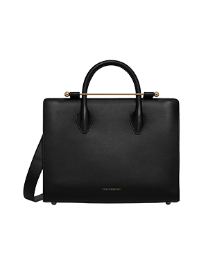 Black Strathberry leather midi tote with top handles, shoulder strap, and gold bar top closure.