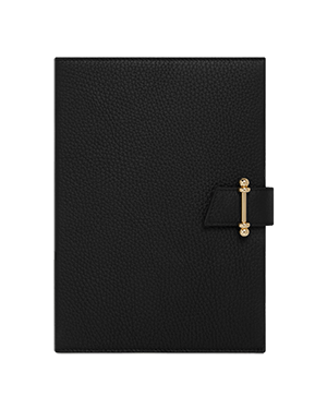 Black notebook with pebbled cover and gold clasp fastening on front cover.