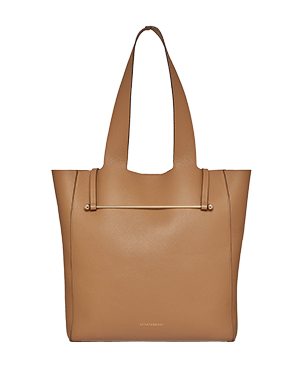 Caramel leather tote bag with long shoulder straps and minimalist gold hardware.