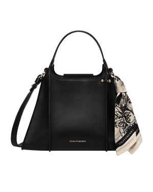 Black Strathberry Arkshell handbag with top handle, shoulder strap and patterned scarf.