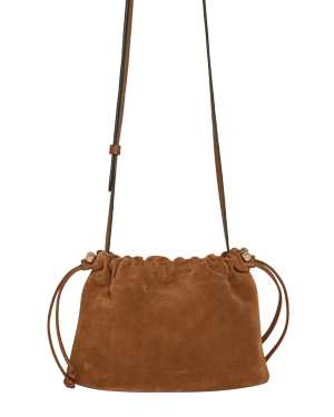 Tan suede drawstring bag with long shoulder strap and gathered top.