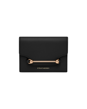 Strathberry Multrees trifold wallet in black with gold bar hardware and logo