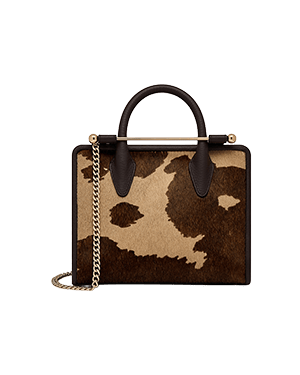 Mini tote with top handles and gold chain strap, sand and espresso spot print.