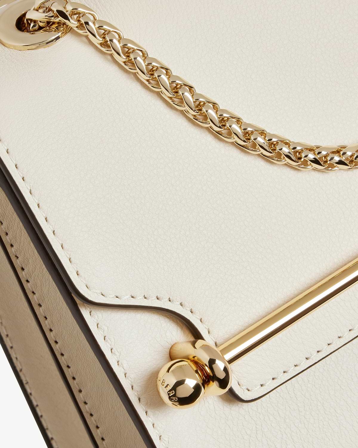 Vanilla leather East/West Mini bag showing gold chain, metal bar and stitching detail
