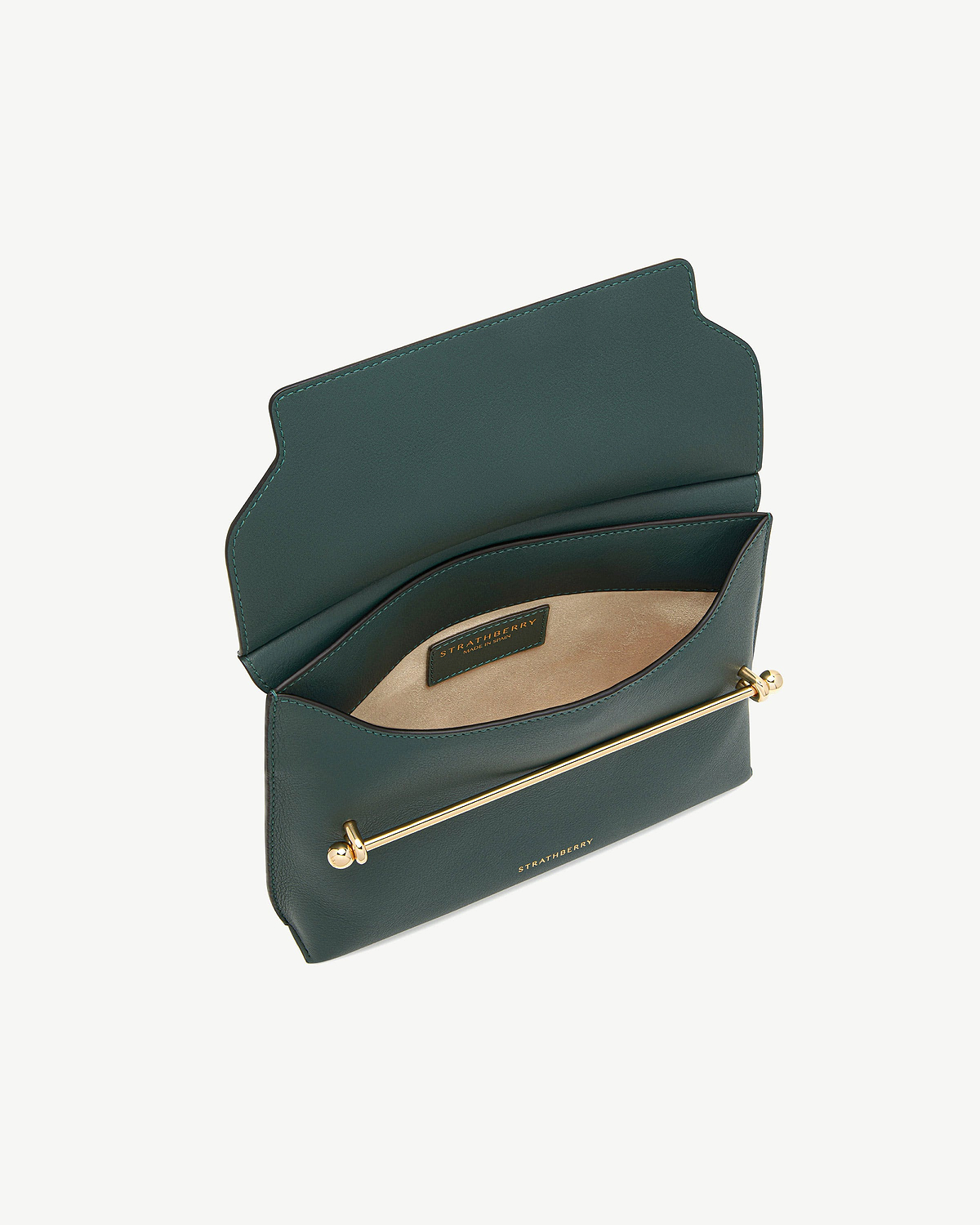 Bottle green bag open, showing suede interior, gold bar hardware and Strathberry label.