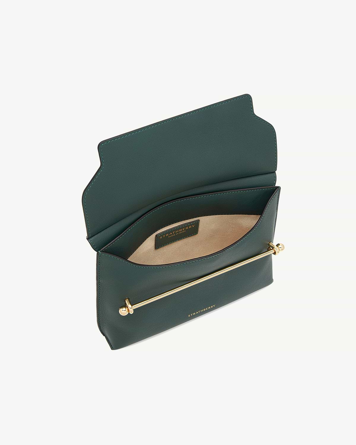 Bottle green bag open, showing suede interior, gold bar hardware and Strathberry label.