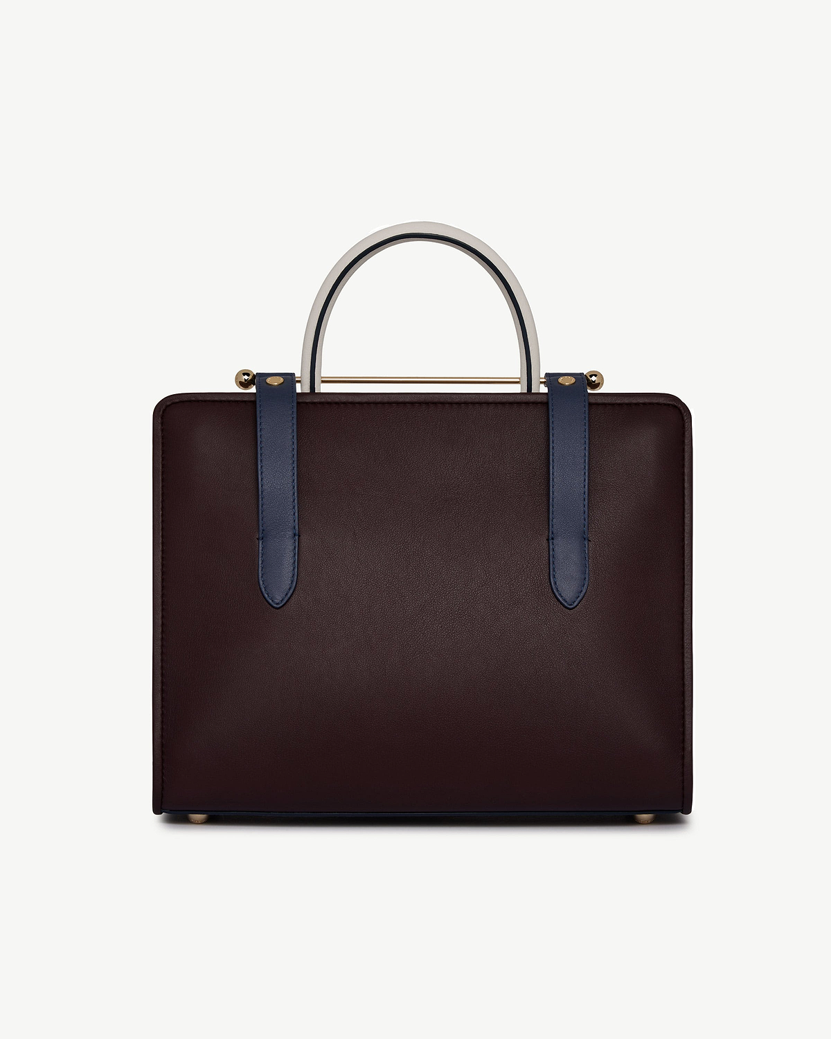 Burgundy leather midi tote with navy straps and vanilla top handle.
