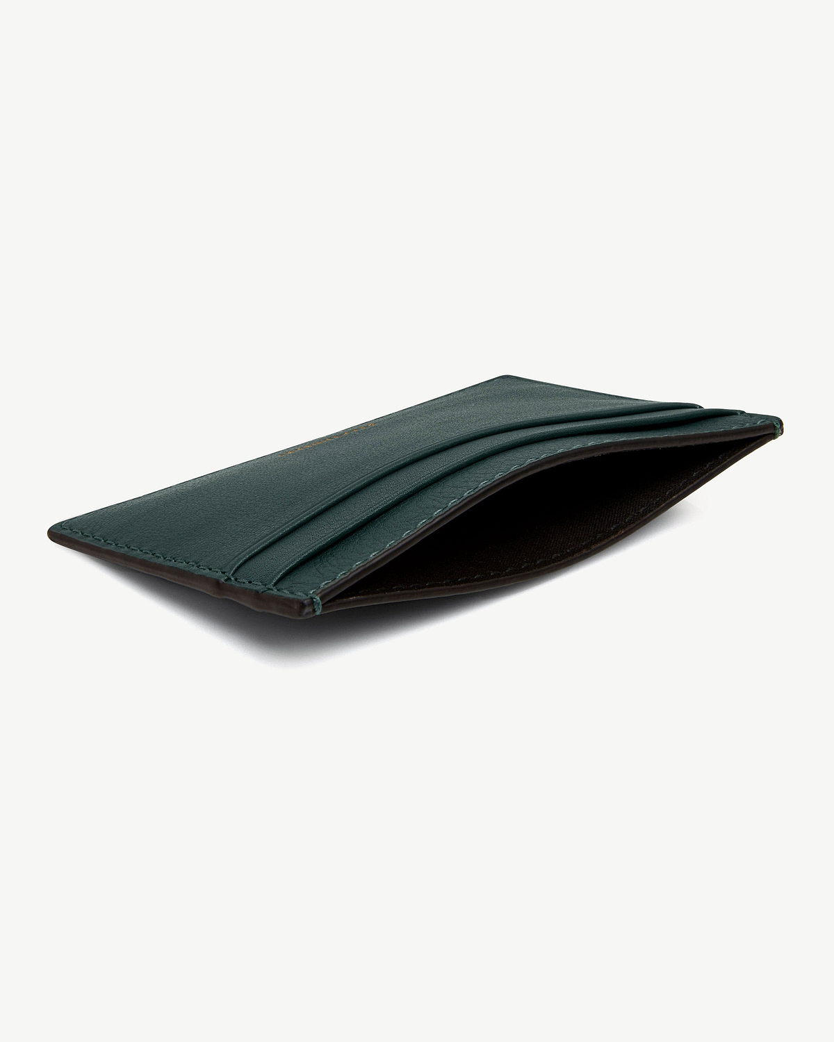 Bottle green leather cardholder with three card slots and central pocket.