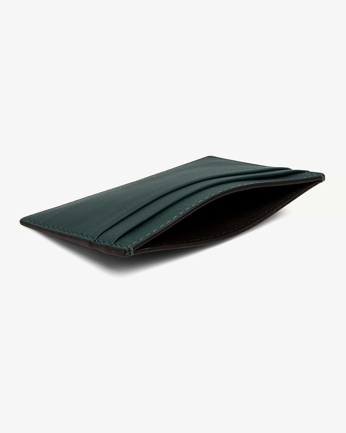 Bottle green leather cardholder with three card slots and central pocket.