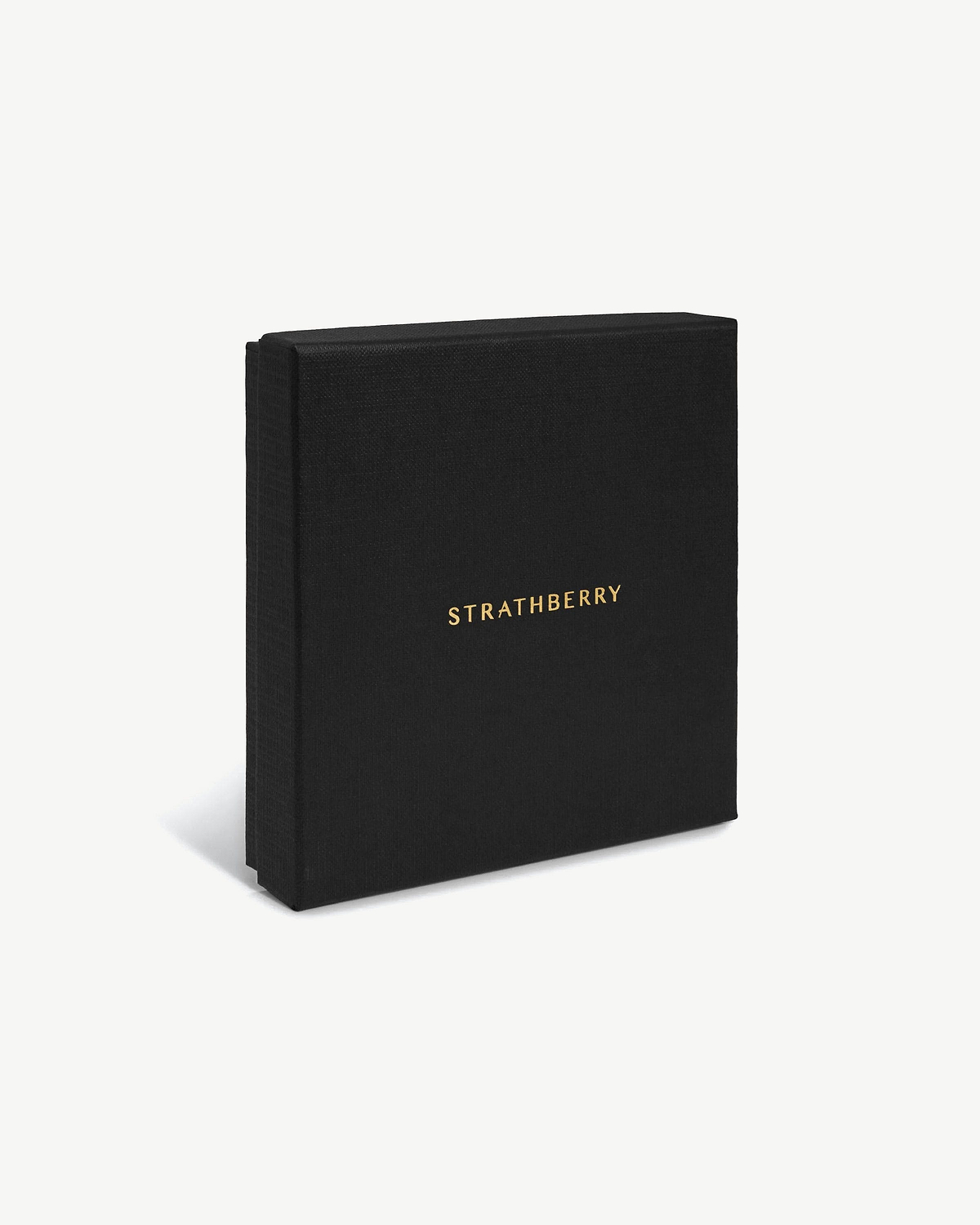 Black Strathberry box standing upright on white background, gold logo centred.