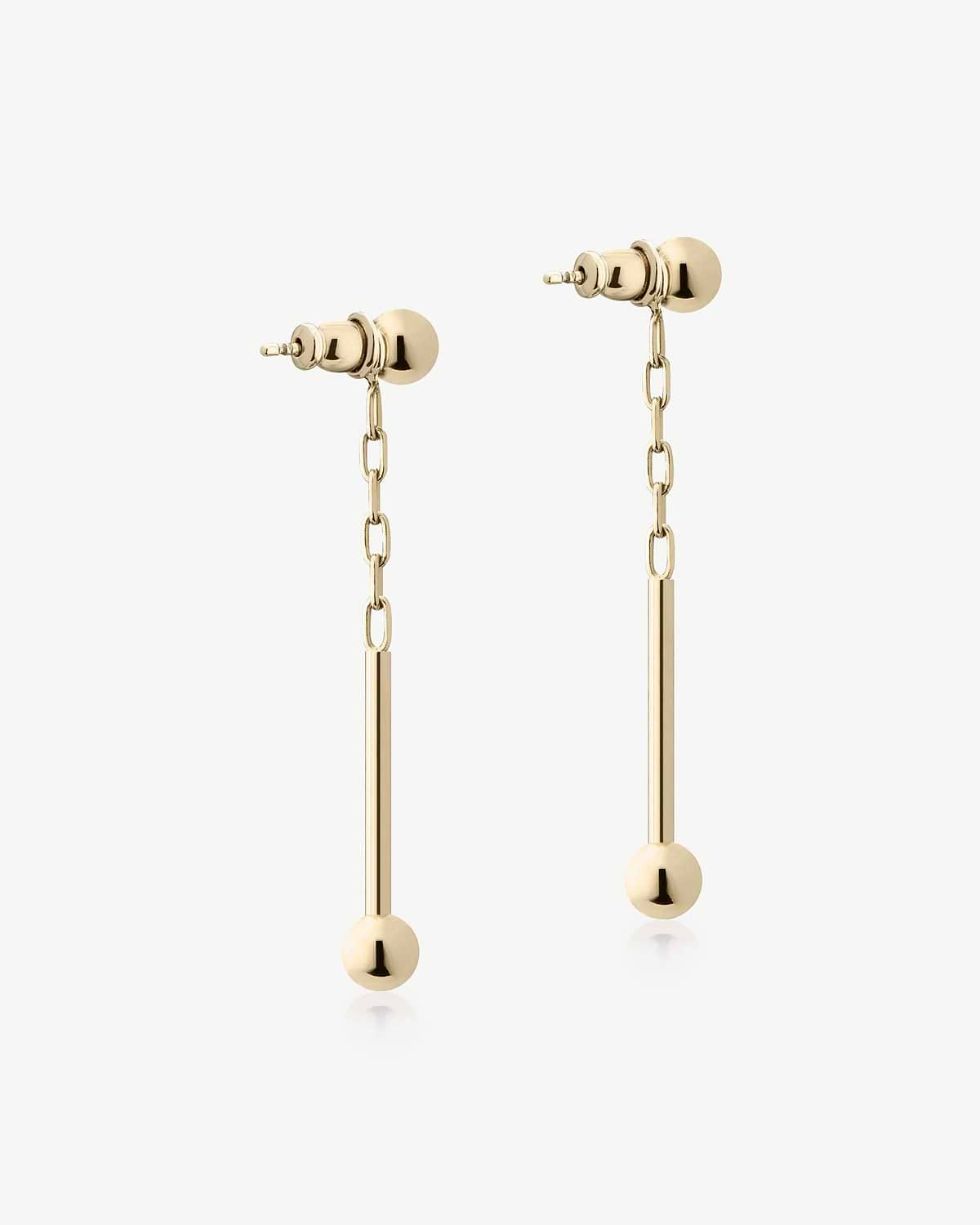 22 carat gold gilded music bar drop earrings with chain and sphere ends.