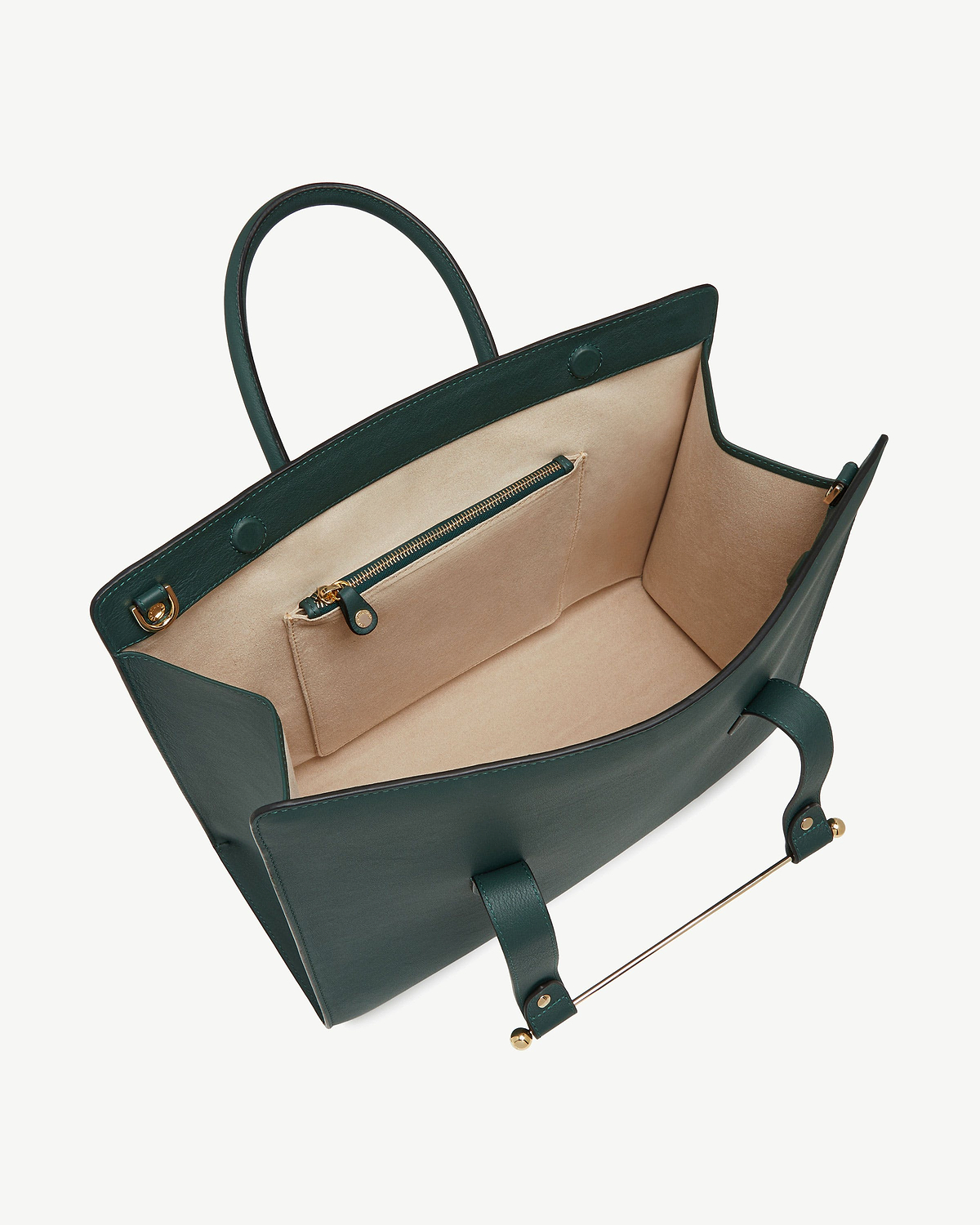 Bottle green leather tote with beige interior, zip pocket and gold hardware.