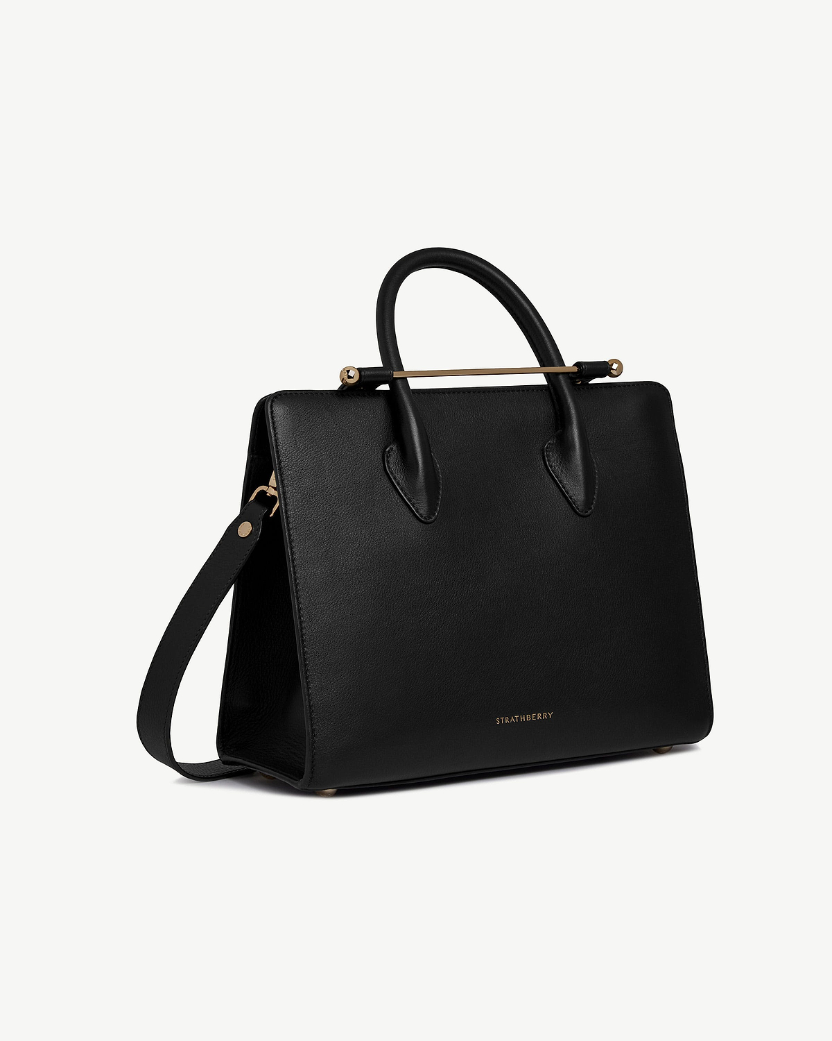 Black Strathberry midi tote with top handles, shoulder strap and gold bar.