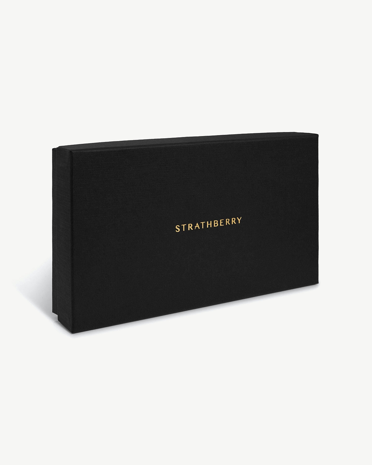 Black textured rectangular box with gold STRATHBERRY logo on a white background.