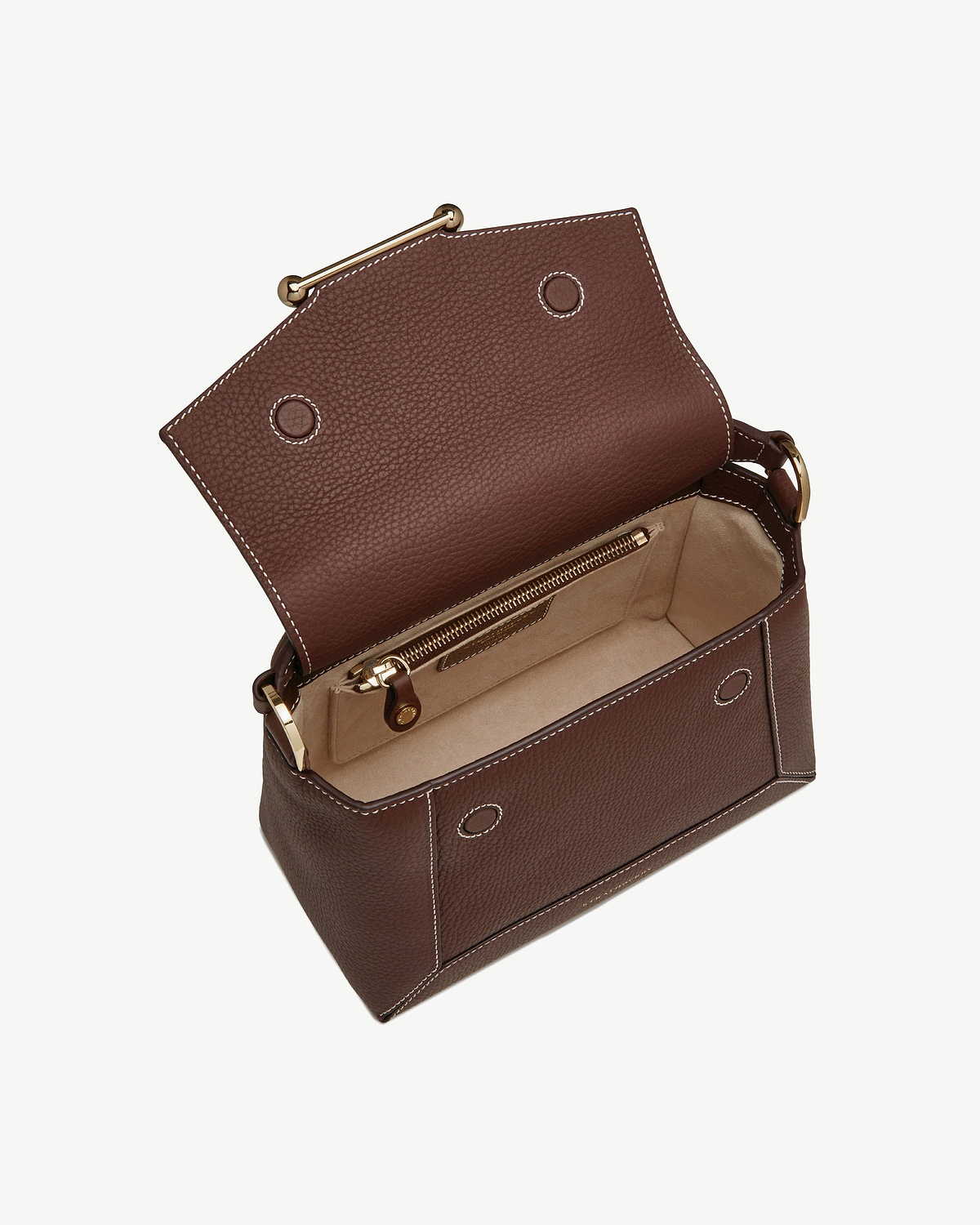 Chocolate leather bag with vanilla stitching, open to show beige interior and zip pocket.