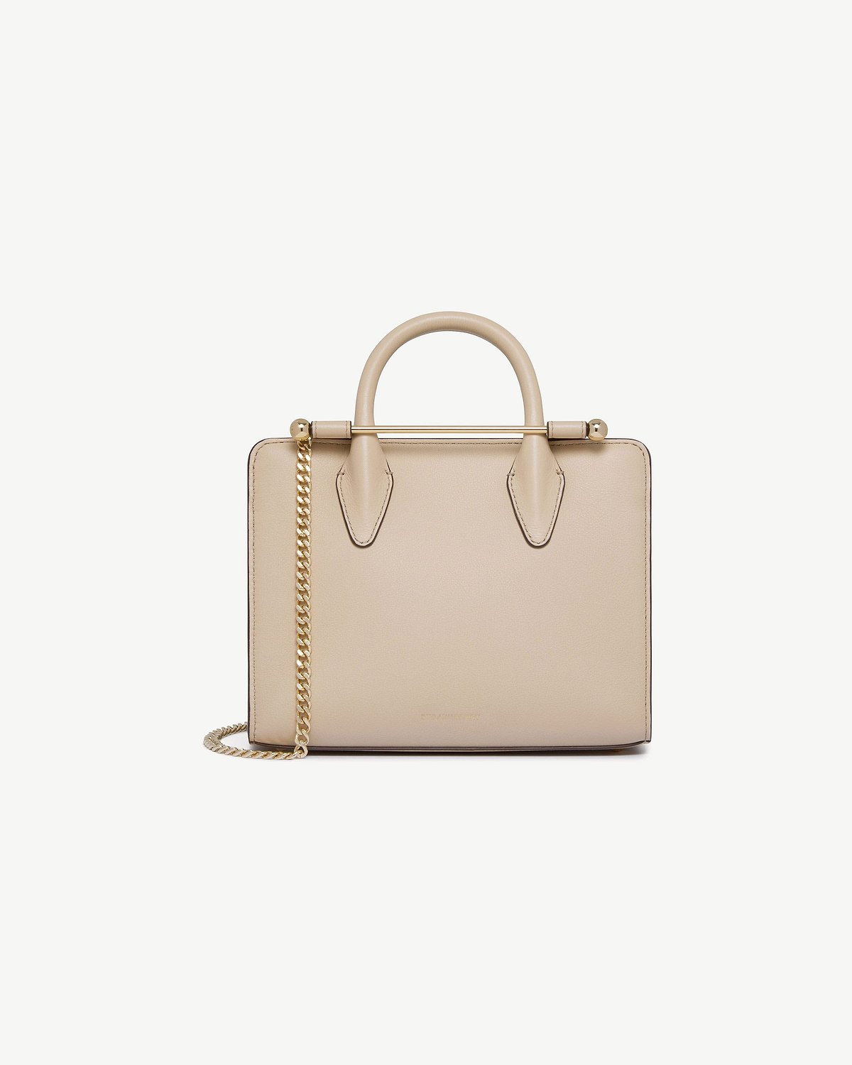 Strathberry oat mini tote with top handles, gold bar and chain shoulder strap.