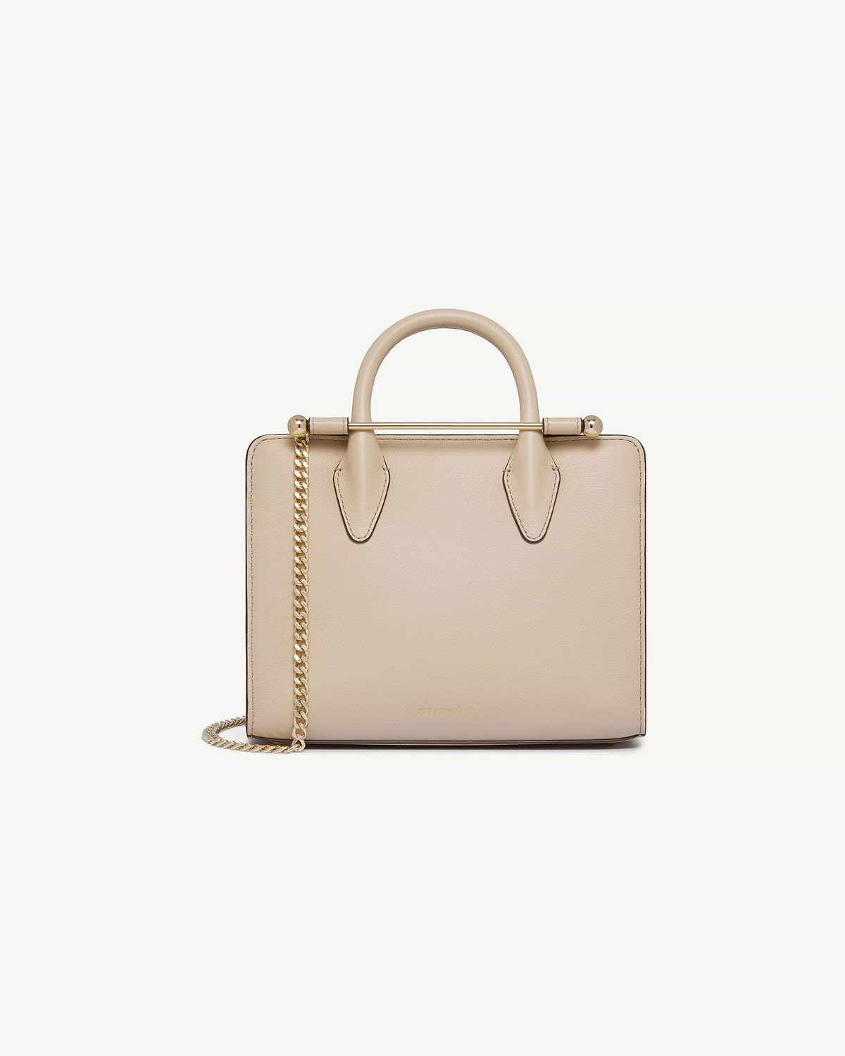 Strathberry oat mini tote with top handles, gold bar and chain shoulder strap.