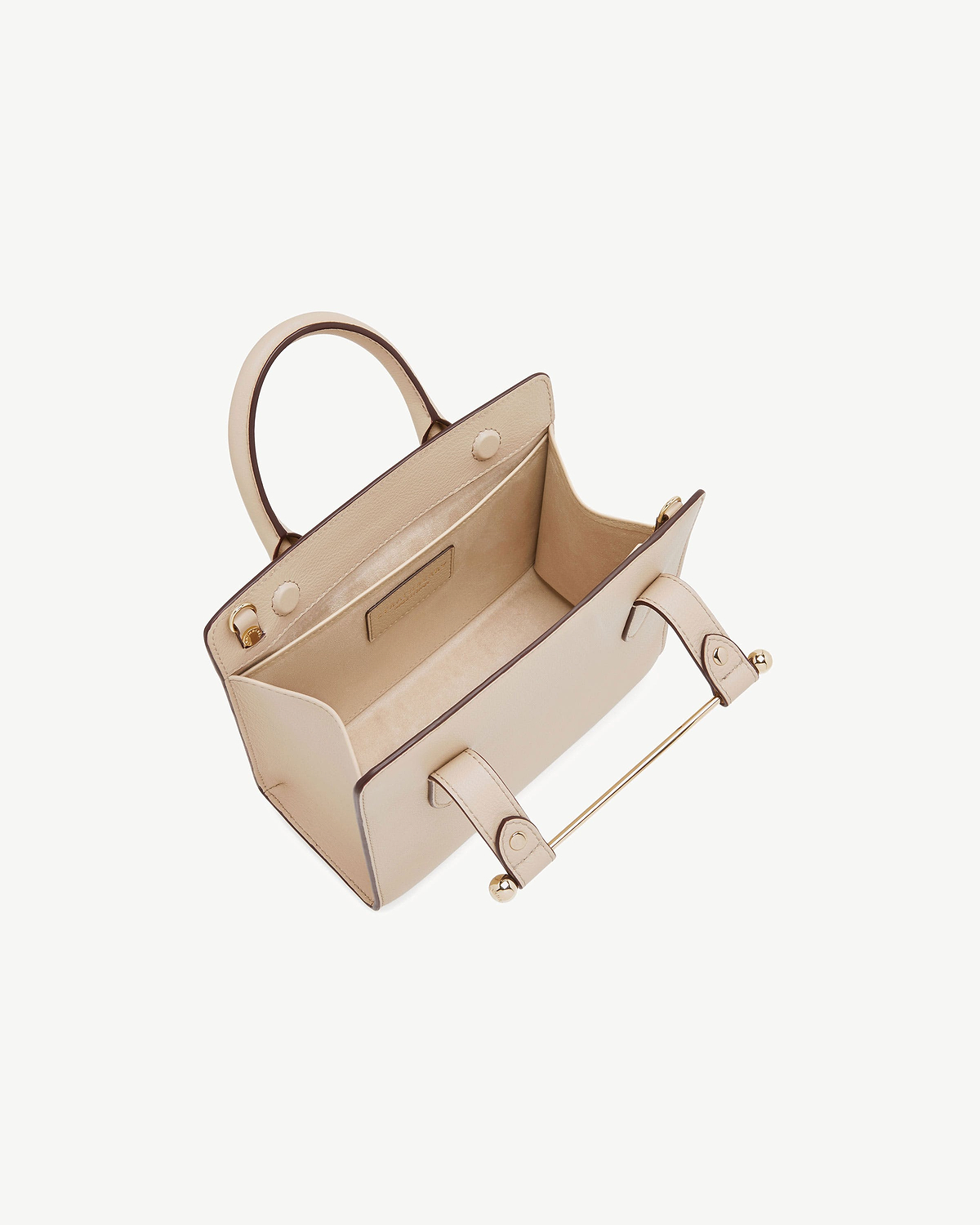 Oat mini tote with open top, visible interior pocket and gold-tone hardware.
