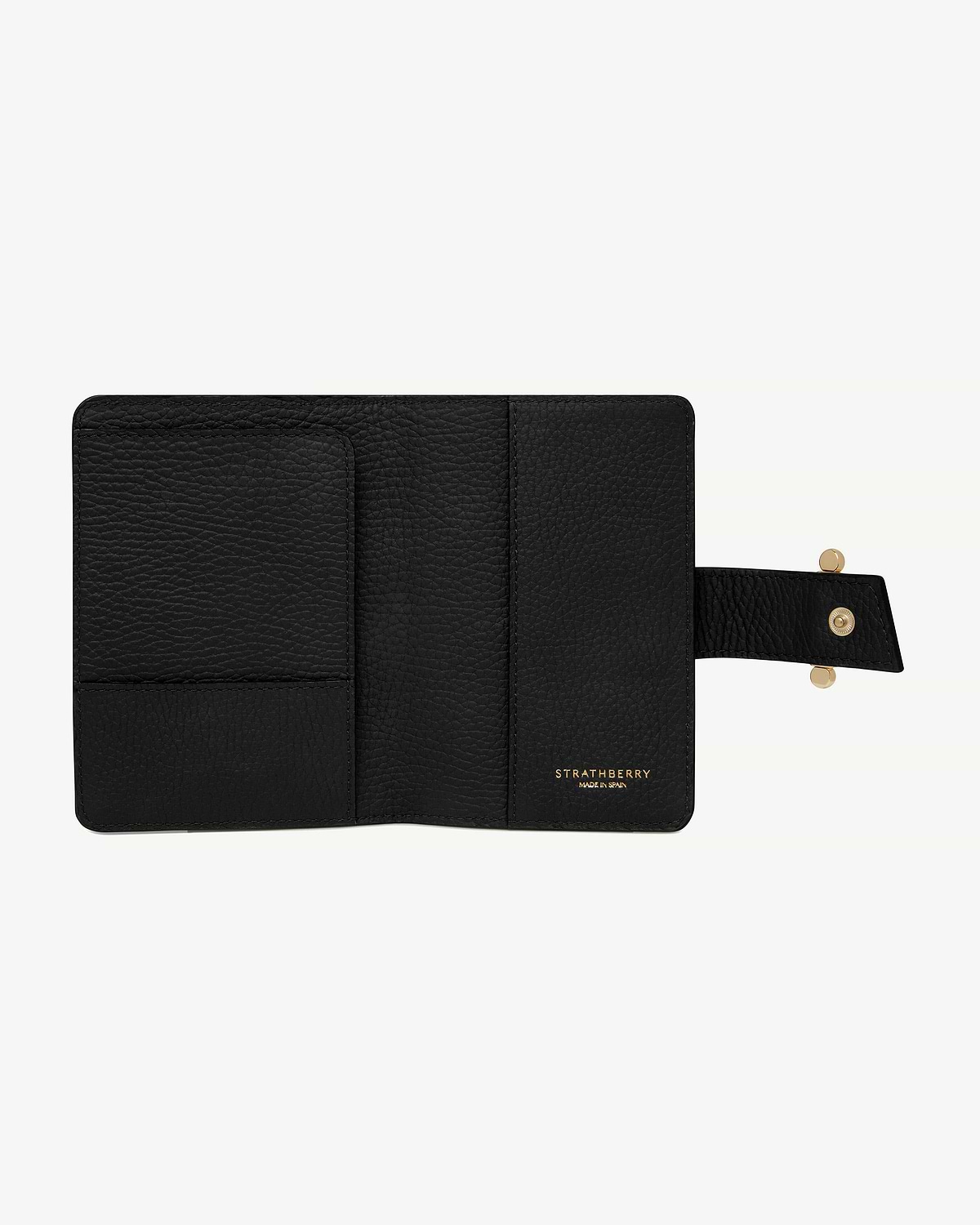 Black Strathberry leather passport holder open, interior pockets and gold logo.