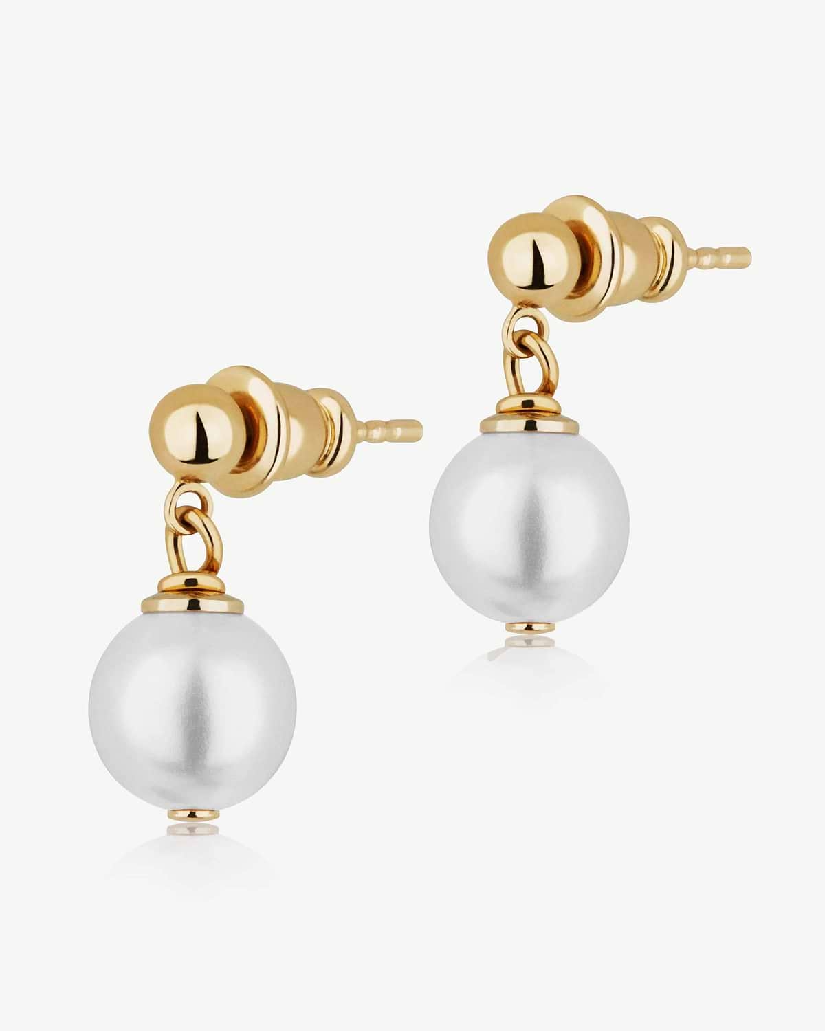 Pair of 24 carat gold-gilded stud earrings with single white pearl drops on white background.