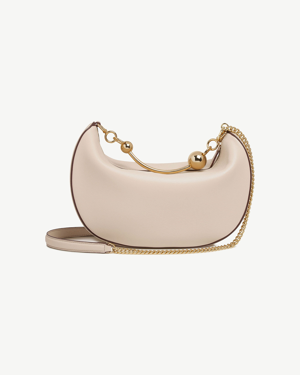 Oat crescent moon bag with gold ball bar and chain shoulder strap.