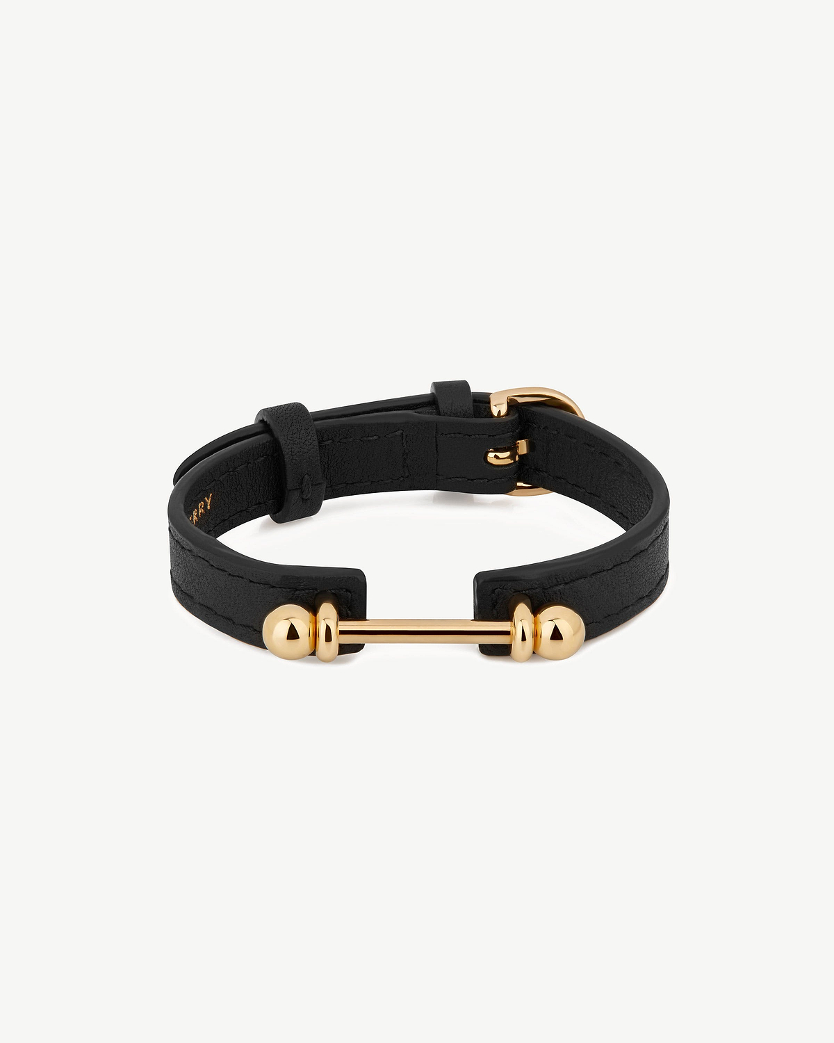 Black leather bracelet with 22 carat gold-gilded bar and buckle.