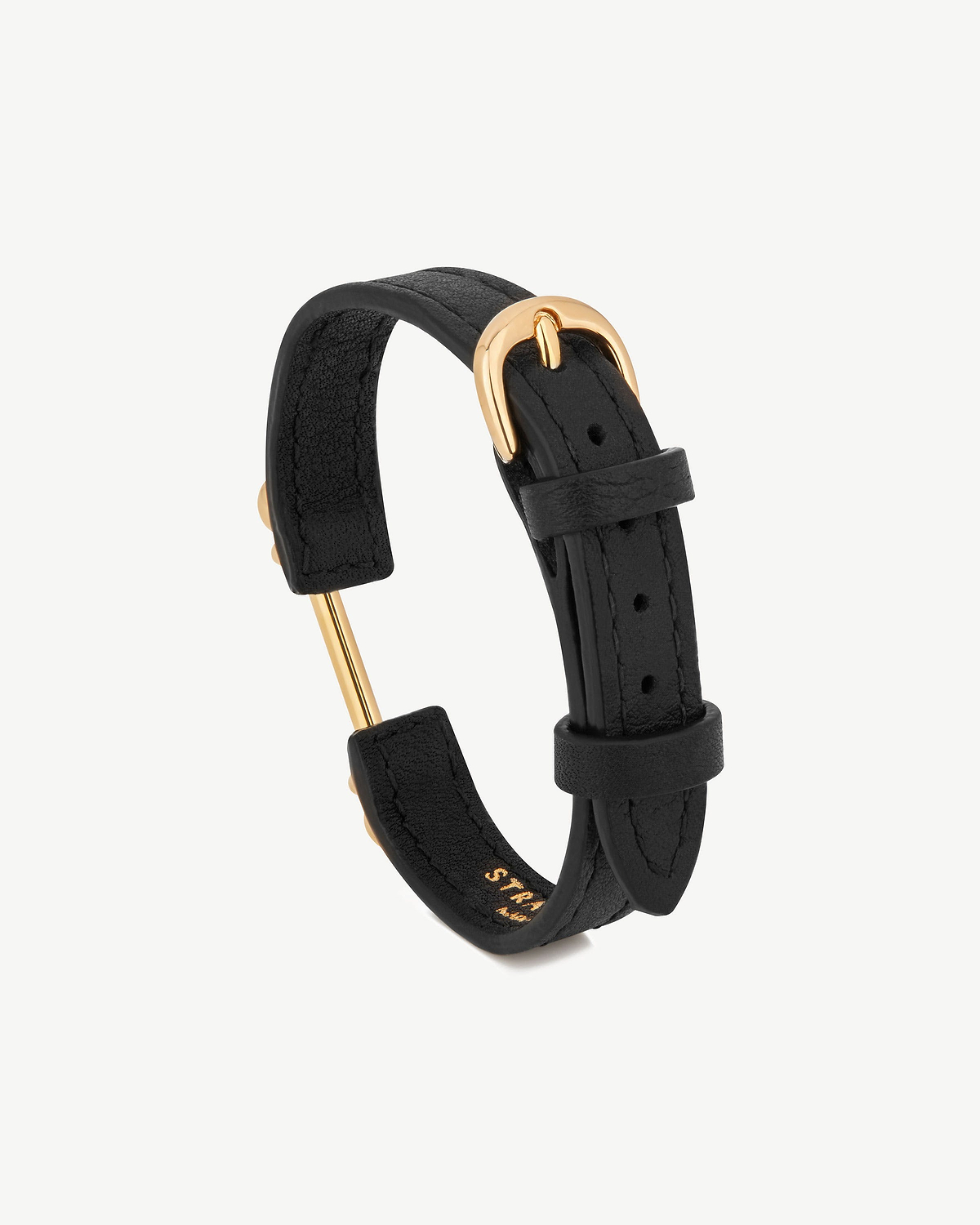 Strathberry black leather bracelet with 22-carat gold bar and buckle.