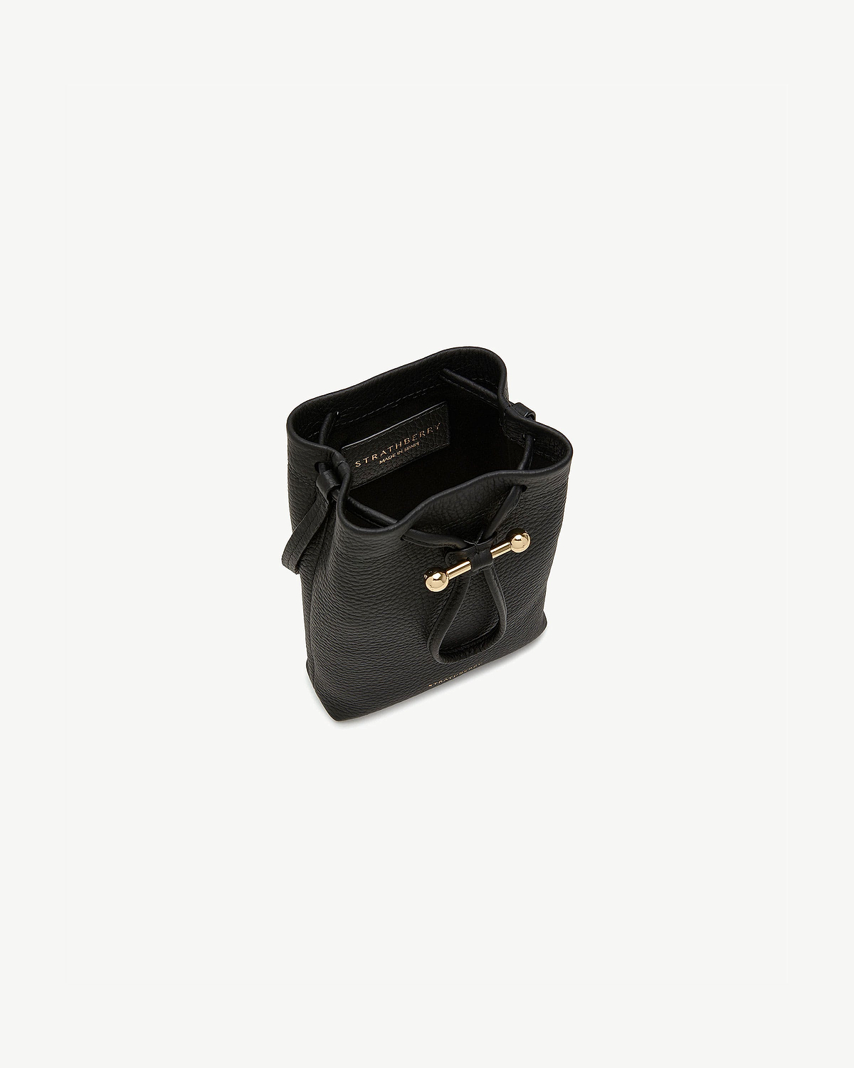 Black Strathberry Osette midi pouch with drawstring and gold bar hardware.