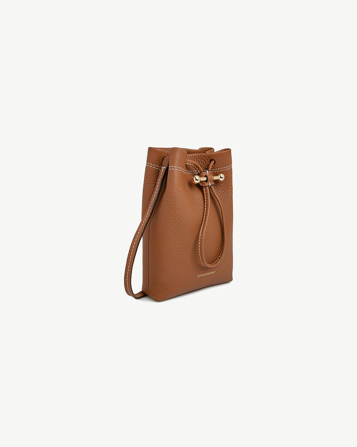 Tan Strathberry Osette midi pouch with drawstring, long strap and gold toggle.