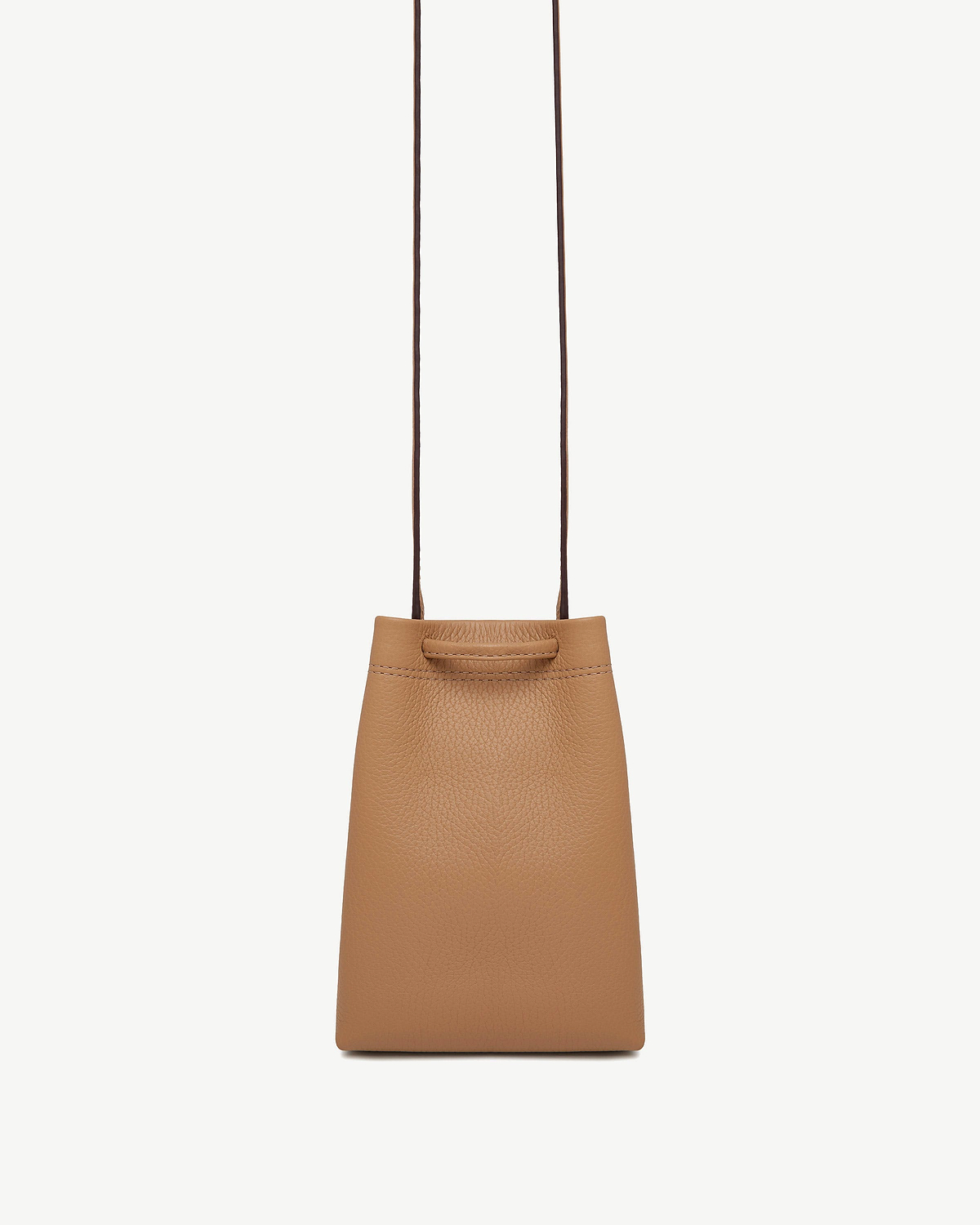 Caramel leather midi pouch with long thin straps on white background.