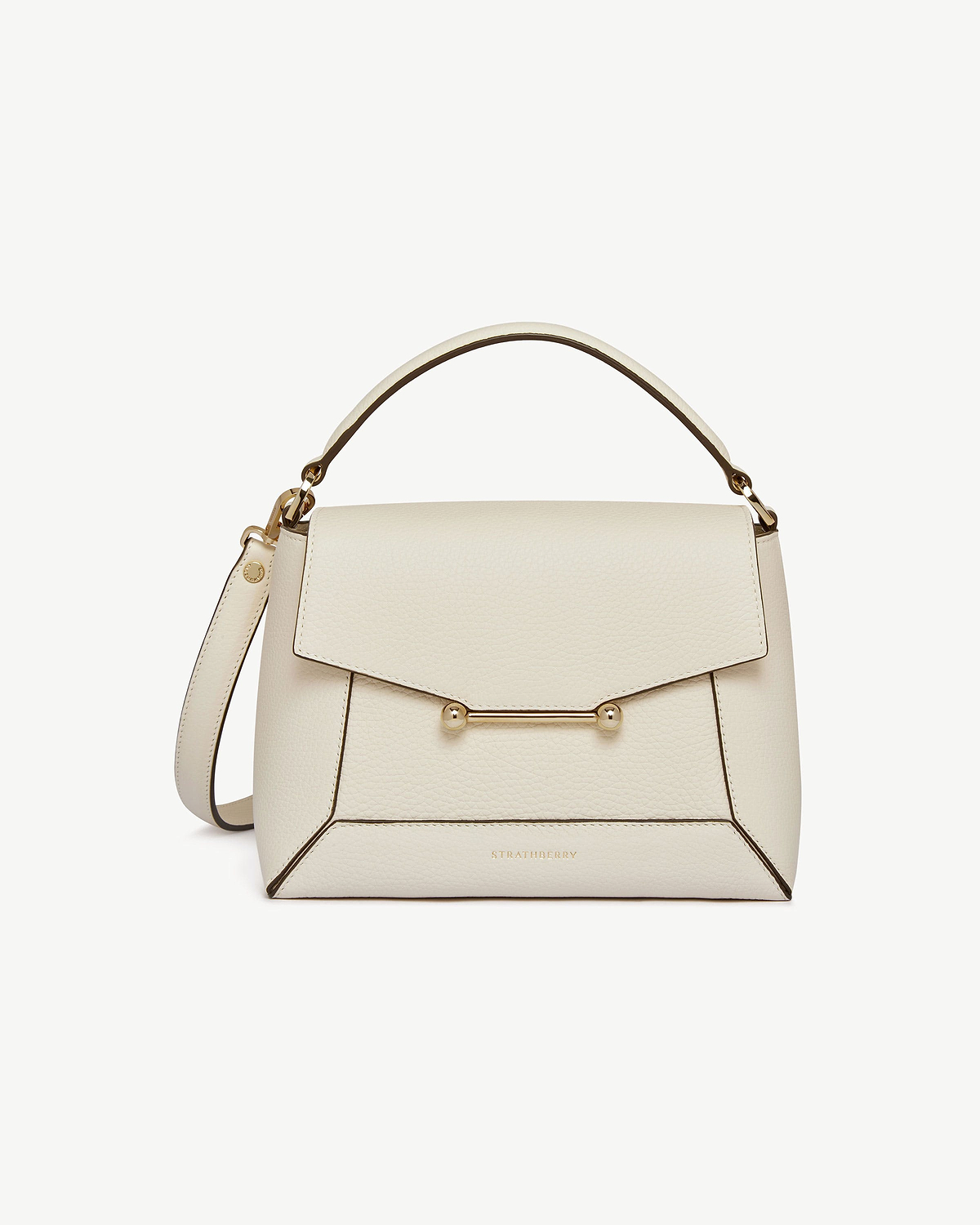 Strathberry Mosaic bag in vanilla leather with top handle and gold bar closure.