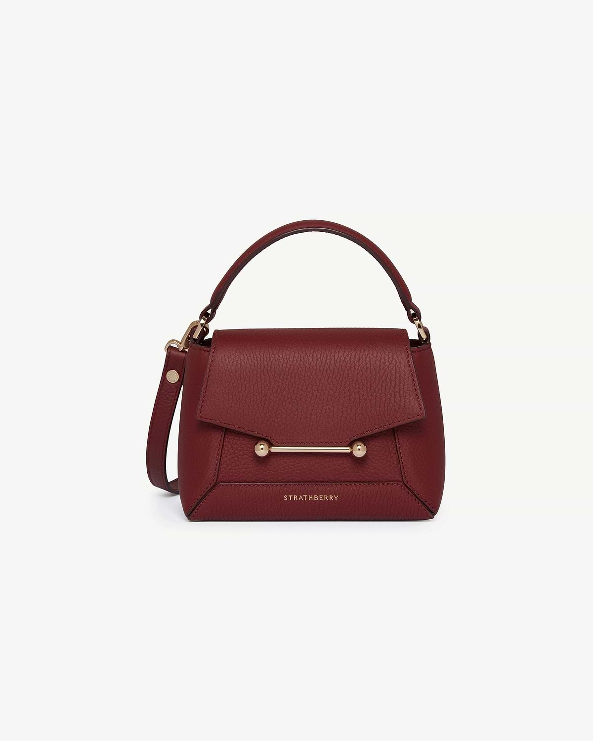 Strathberry Mosaic Nano oxblood leather top-handle bag with gold bar closure.