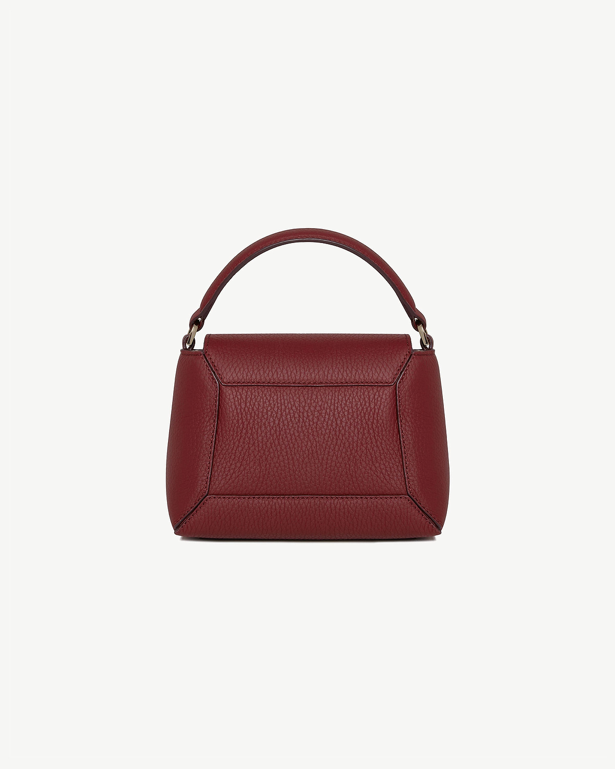 Small structured oxblood leather top handle bag with pebbled grain texture.