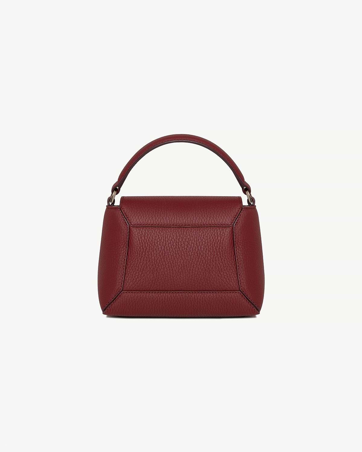 Small structured oxblood leather top handle bag with pebbled grain texture.