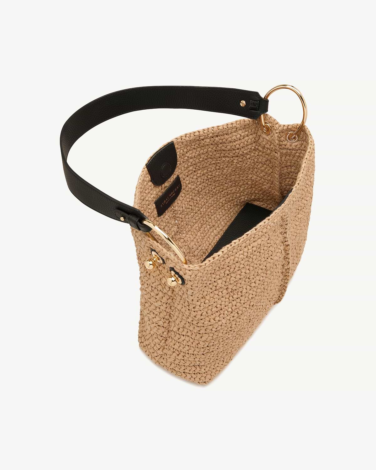 Raffia Strathberry hobo bag with black leather strap and gold ring hardware.