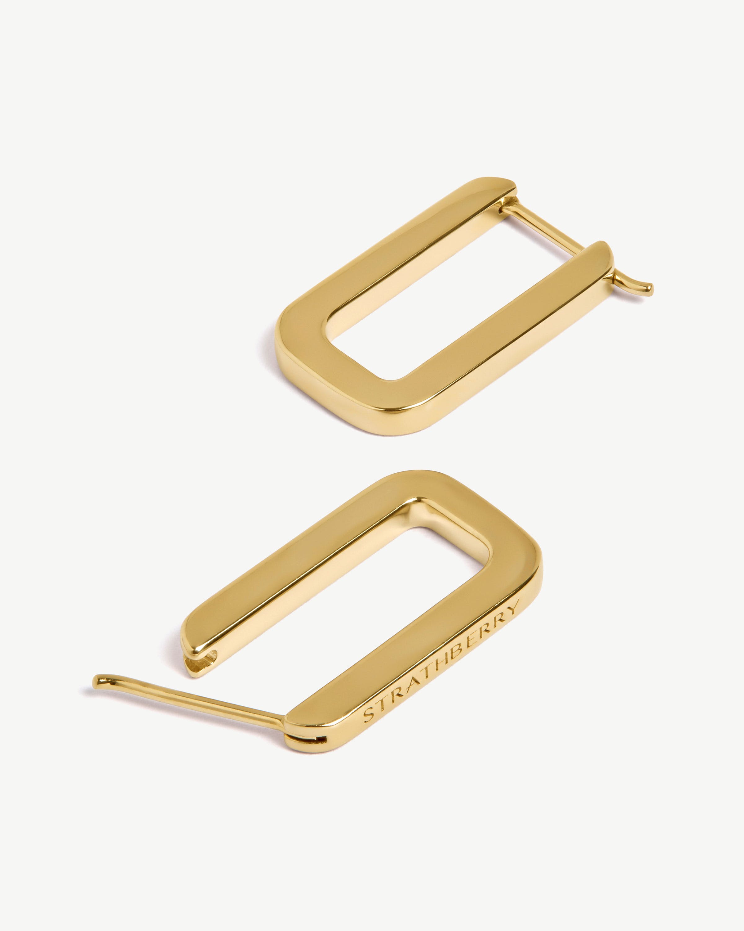 Pair of rectangular hoop earrings, 22-carat gold gilded, with Strathberry engraving.