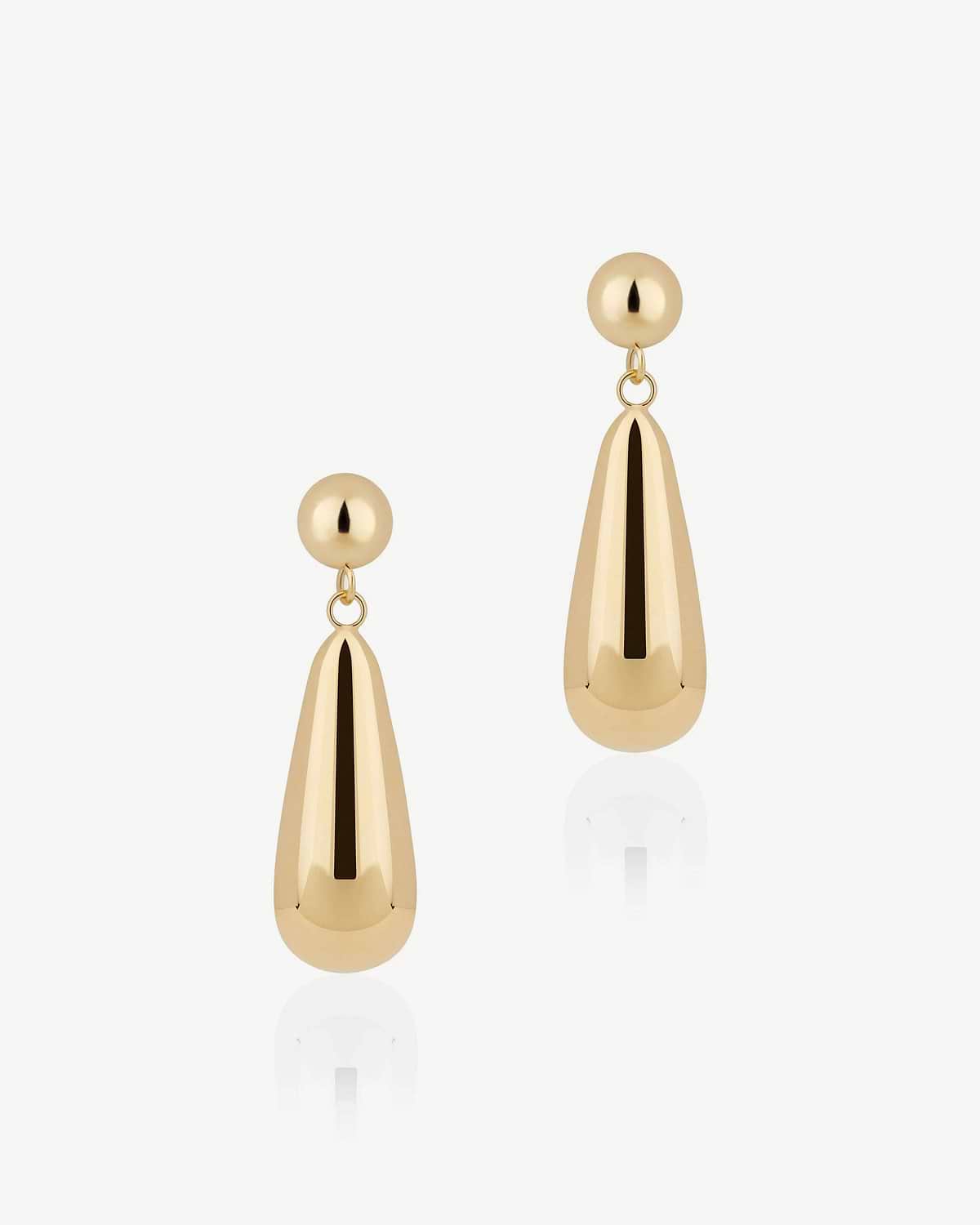 Pair of 24-carat gold gilded teardrop earrings on white background