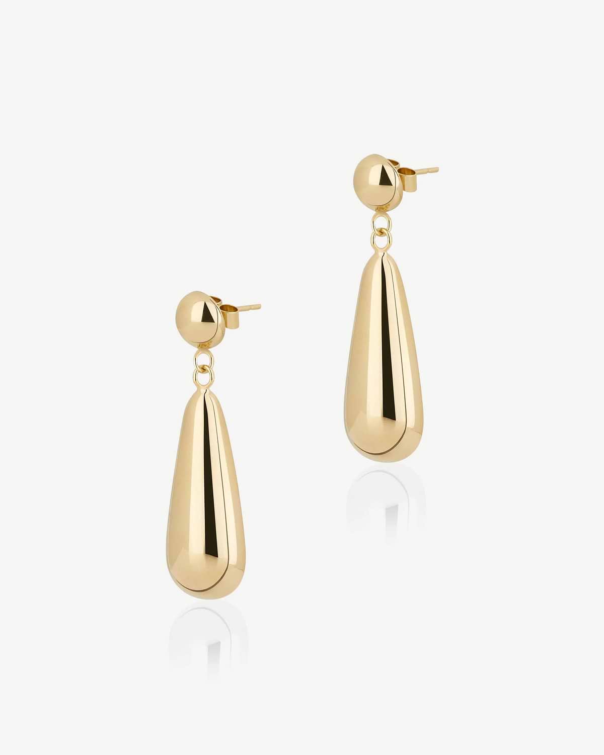 Pair of 24 carat gold-gilded Jasmine drop earrings on white background.