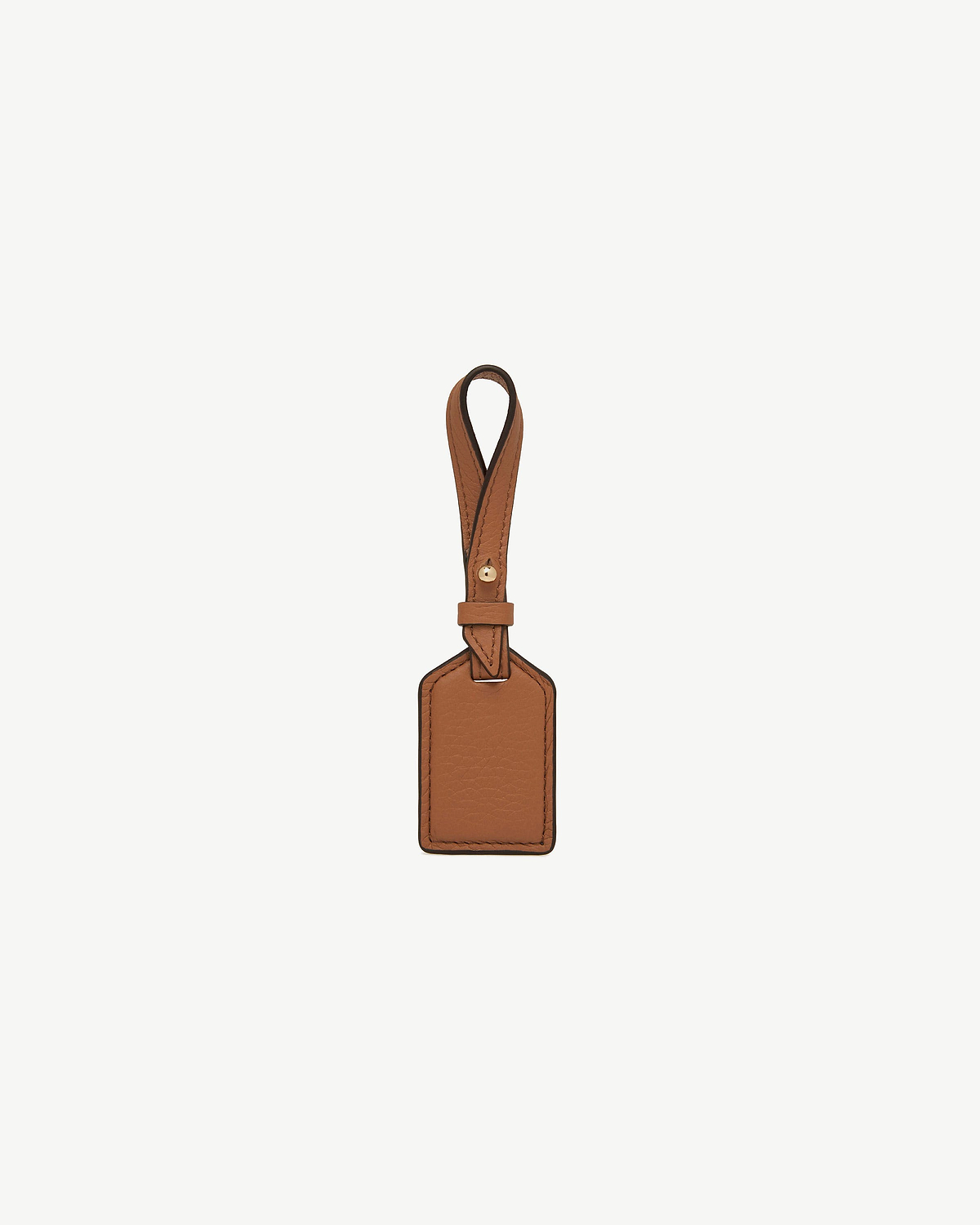 Tan rectangular leather tag with stitched edges and loop strap.